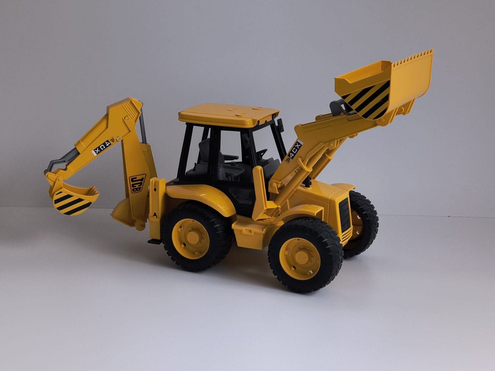 JCB 4CX Speelgoed Graafmachine - Geel, Ophalen of Verzenden, Gebruikt