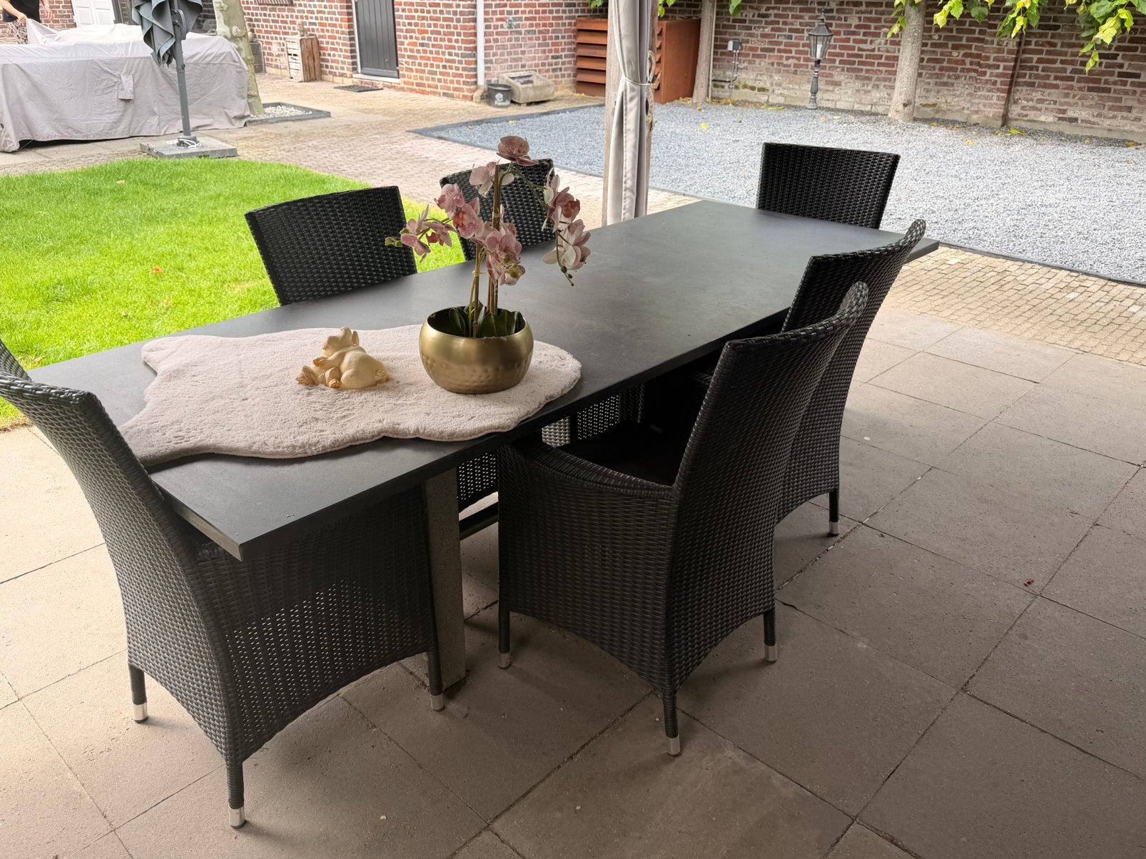 tuintafel met een elegant granieten en 6 stoelen, Tuin en Terras, Ophalen, Zo goed als nieuw, Wicker