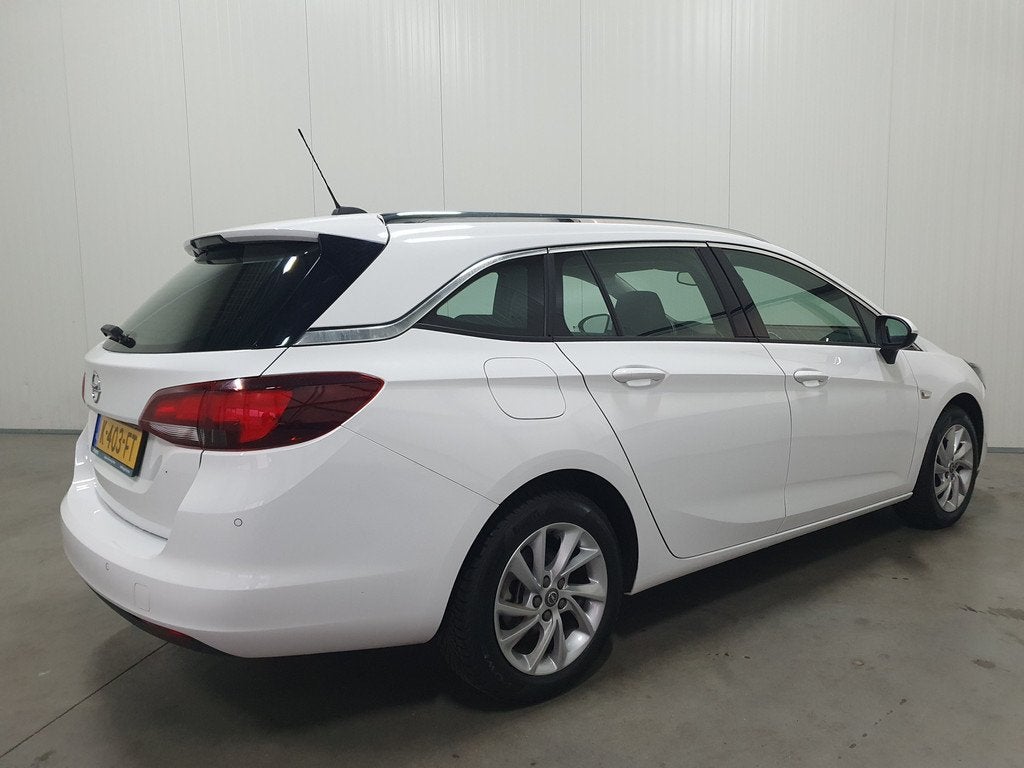 Opel Astra Sports Tourer 1.2 Elegance NAVI/PDC/CRUISE/CLIMA/, Voorwielaandrijving, Gebruikt, Euro 6, Leder en Stof
