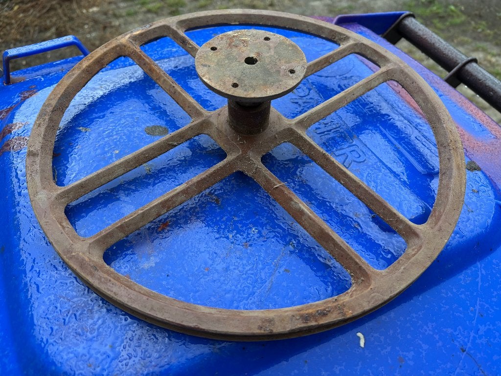 vliegwiel trapnaaimachine, Ophalen