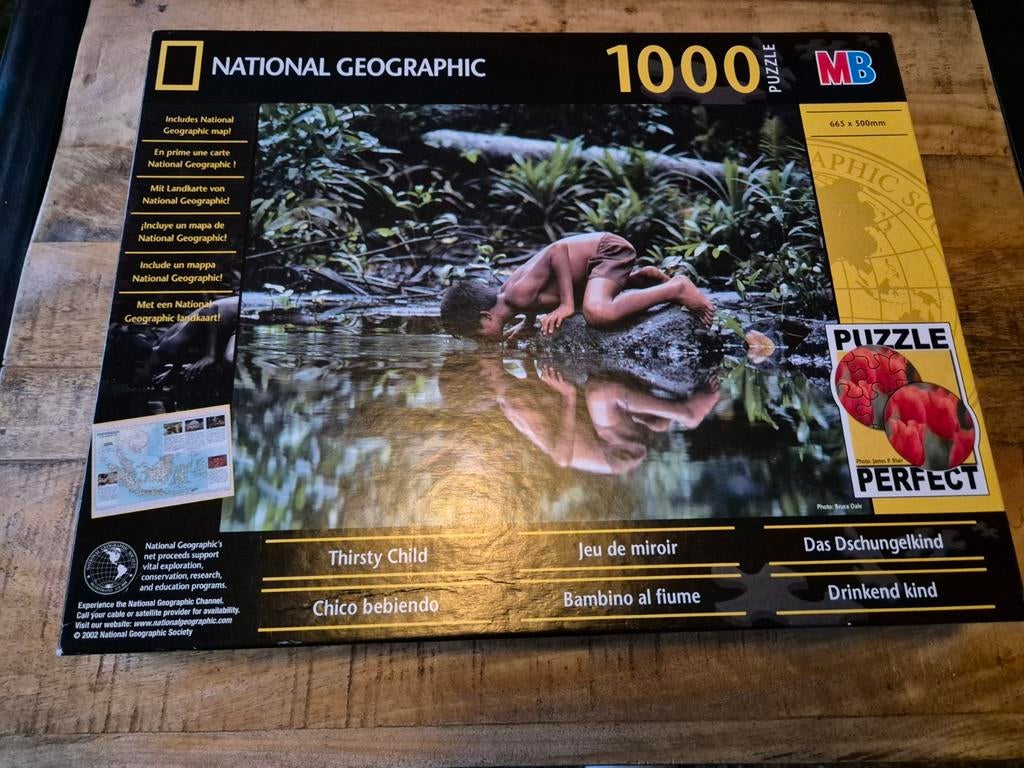 MB National Geographic Puzzel 1000 stukjes - Drinkend Kind, Ophalen of Verzenden, 500 t/m 1500 stukjes