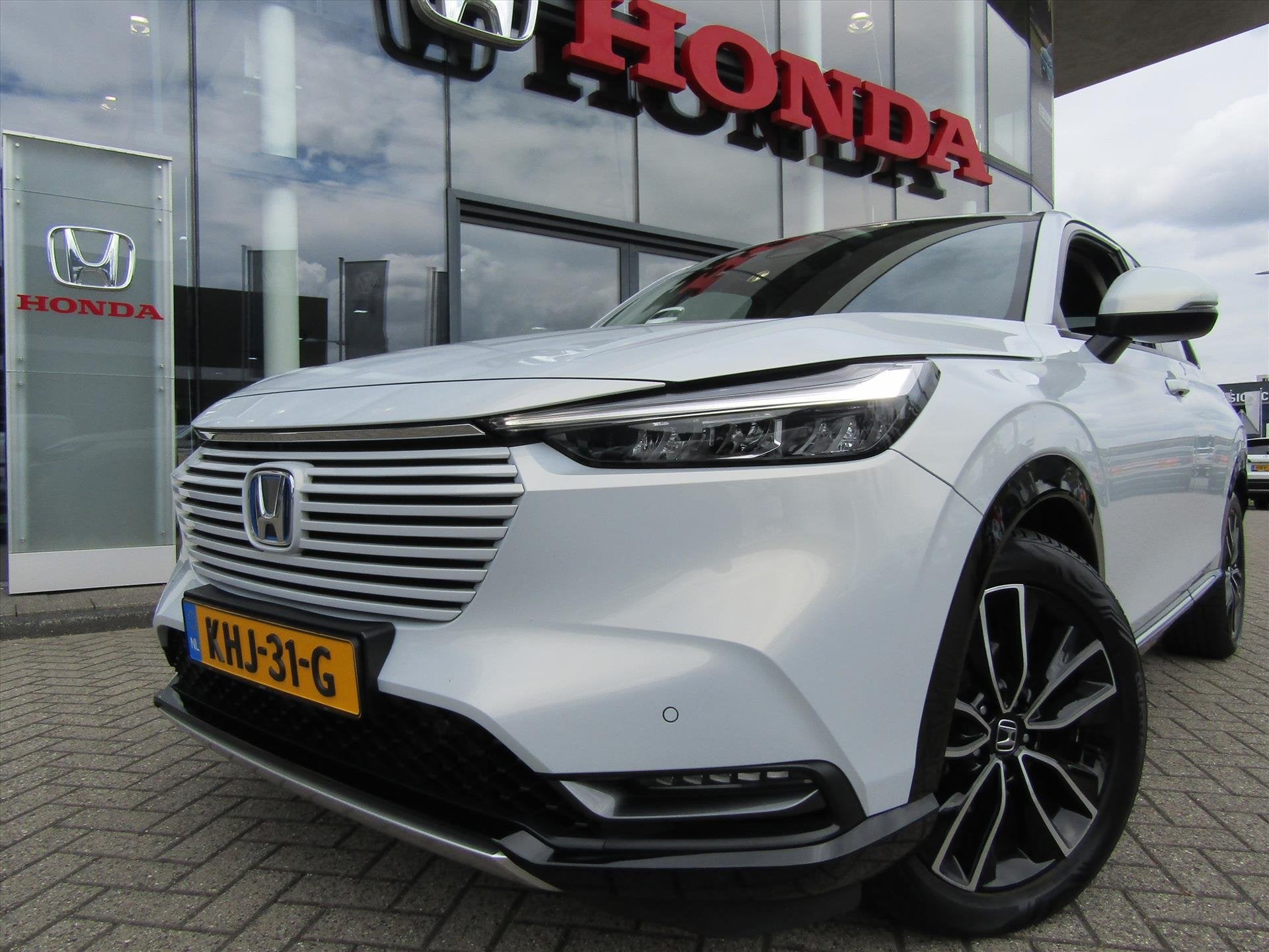 Honda HR-V 1.5 i-MMD 131pk CVT Advance,Allweather banden, Leder en Stof, Wit, Bedrijf, 19 km/l