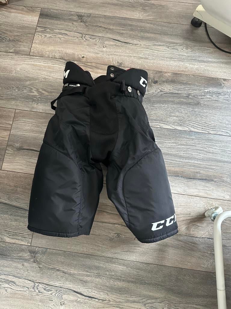 IJshockeybroek Junior XL - CCM, Sport en Fitness, IJshockey, Ophalen of Verzenden, Zo goed als nieuw, Kleding