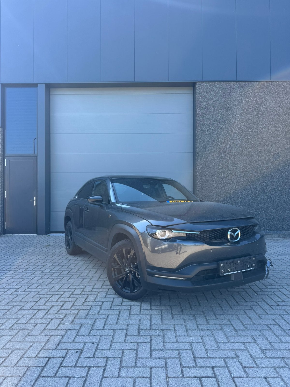 Mazda MX-30 E-skyactiv R-ev 170pk Aut 2023 Grijs, Auto's, Mazda, 74 pk, 4 cilinders, Plug-in hybride, Bedrijf