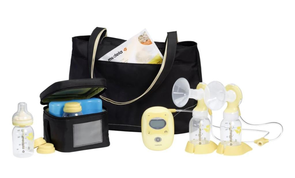 Medela freestyle dubbele kolf met tas en accessoires, Ophalen of Verzenden, Zo goed als nieuw, Borstkolf