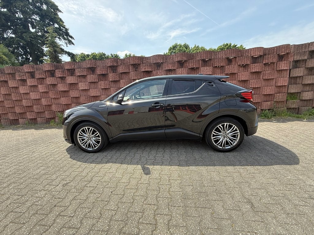 Toyota C-HR 2.0 Hybrid 184pk CVT 2021 Stoel/stuur verwarming, Auto's, Toyota, 725 kg, Euro 6, 4 cilinders, Leder