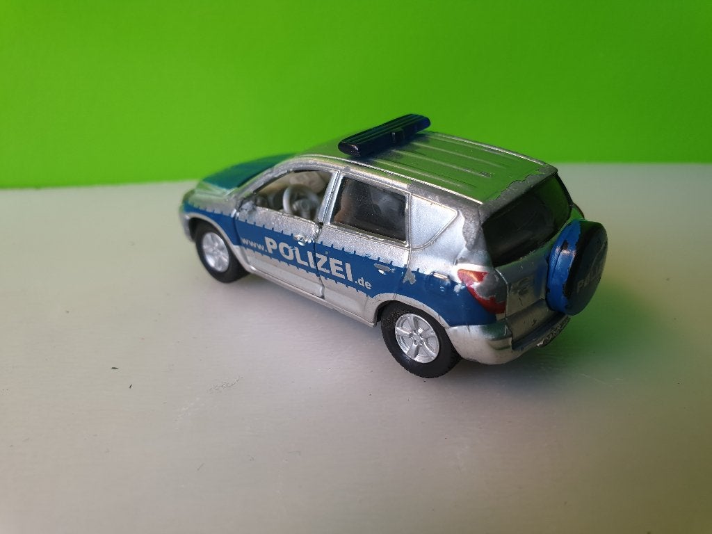 Siku 1431 - Toyota RAV4 Polizei [zilver] 1/55, Ophalen of Verzenden, Gebruikt, Auto
