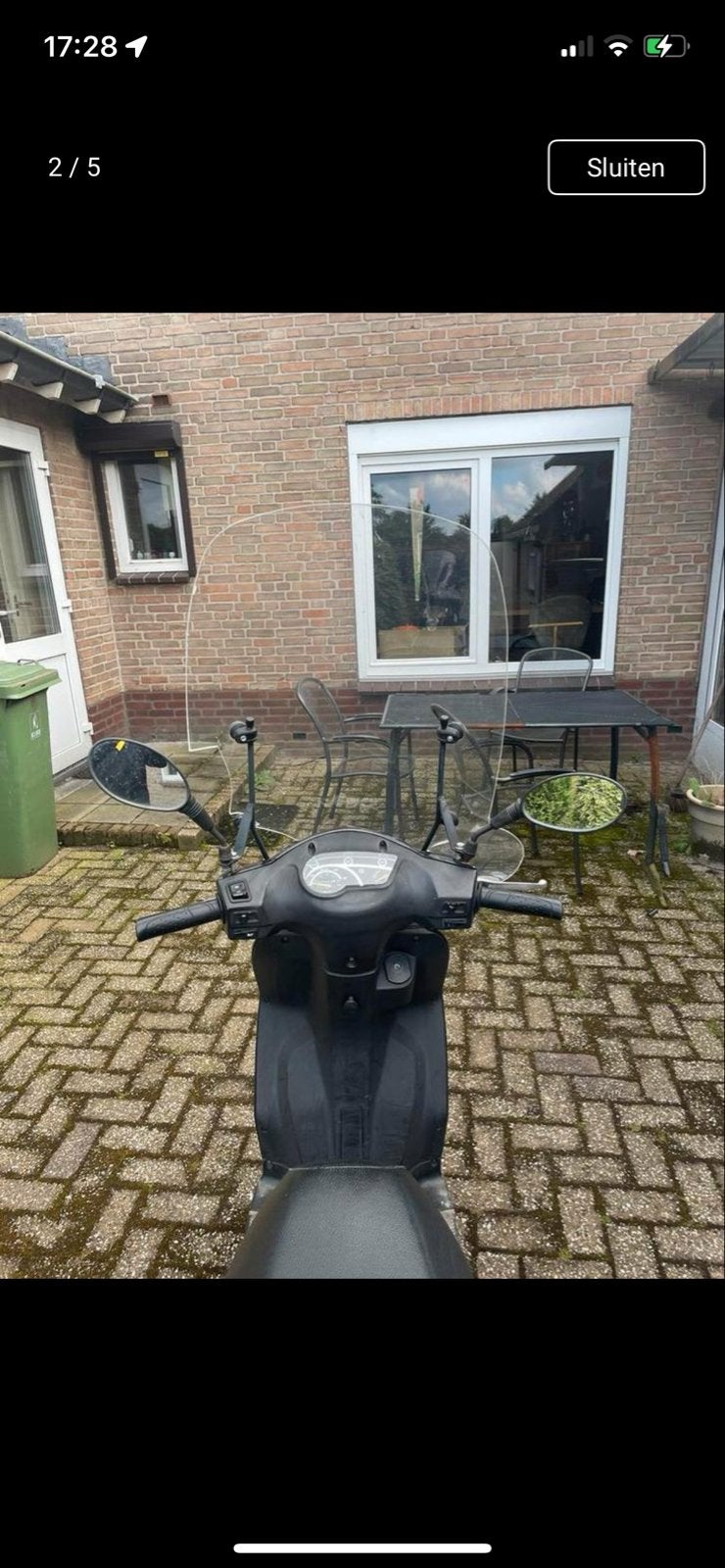 Zwarte scooter met windscherm, Ophalen, Gebruikt