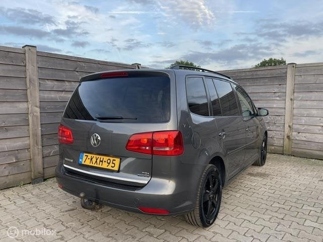 Volkswagen Touran 1.6 TDI Highline BlueMotion 7Persoons, Auto's, Voorwielaandrijving, Euro 5, Stof, Gebruikt