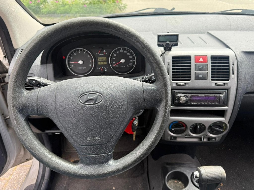 Hyundai Getz 1.3i Dynamic Automaat (CRUISE), Auto's, Hyundai, Zwart, 4 cilinders, Bedrijf, Getz