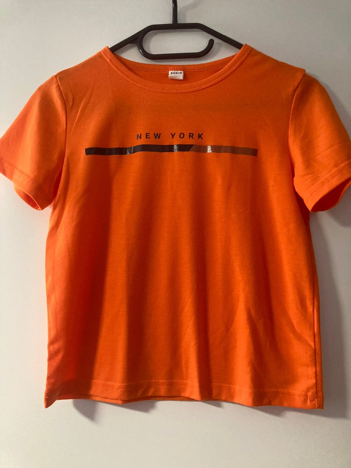 Nette oranje T-shirt maat 128, Ophalen of Verzenden, Zo goed als nieuw, Jongen, Shirt of Longsleeve