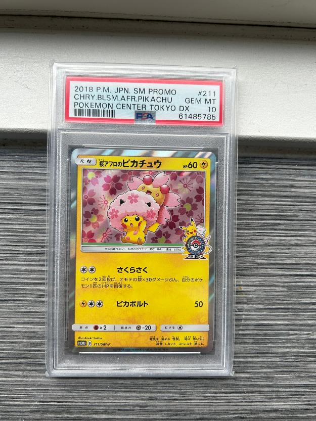 PSA 10 - Cherry Blossom Afro Pikachu 211/SM-P - Promo, Ophalen of Verzenden, Nieuw, Losse kaart, Foil