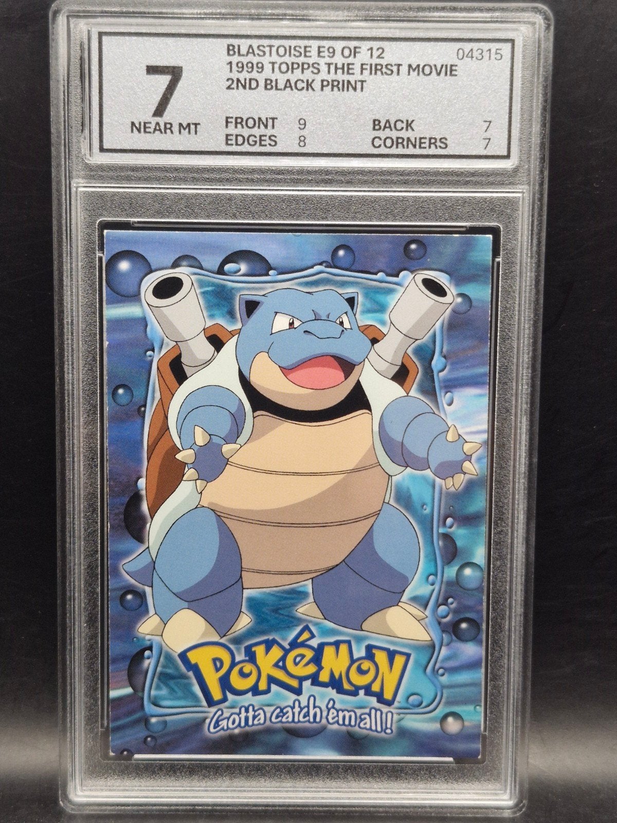 Blastoise 1999 topps the first movie #e9 woetoe grading 7, Verzenden, Zo goed als nieuw, Losse kaart