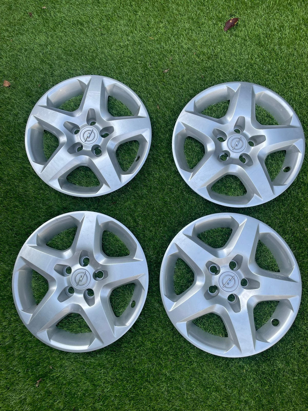 Originele 16 inch 5-spaaks Opel wieldoppen set, Ophalen of Verzenden, Gebruikt