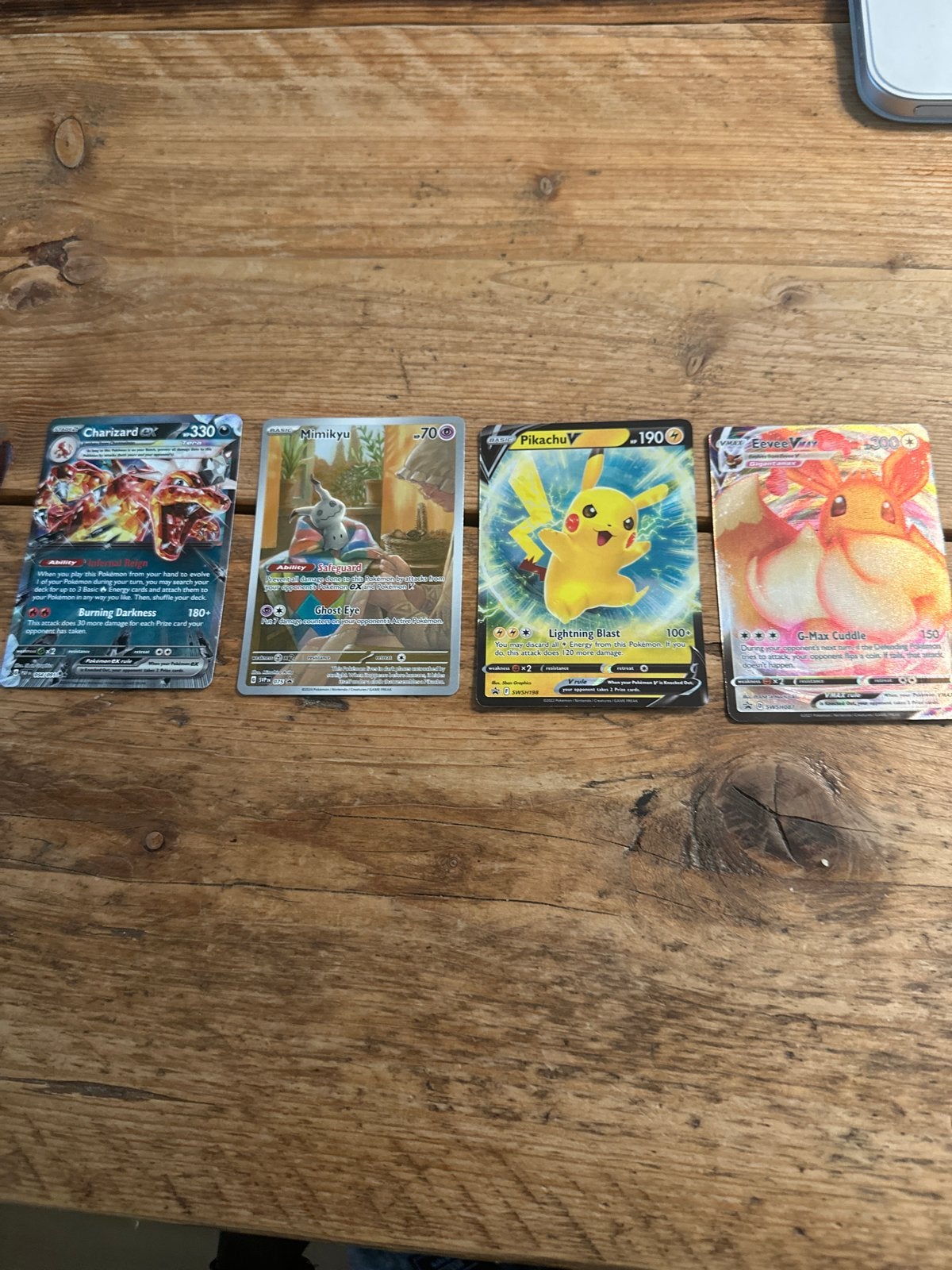 Pokémon Kaarten: Charizard, Mimikyu, Pikachu V, Eevee VMAX, Hobby en Vrije tijd, Ophalen of Verzenden, Zo goed als nieuw, Meerdere kaarten