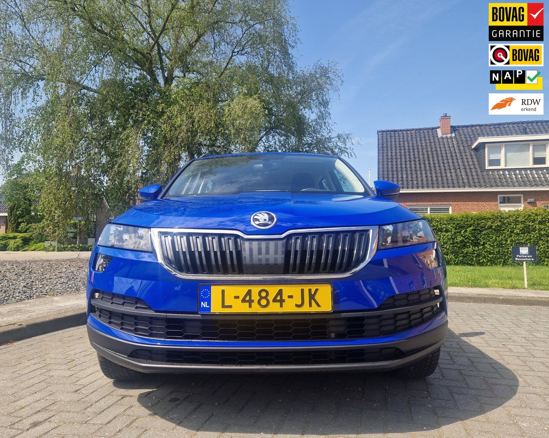 Skoda Karoq 1.5 TSI AUTOMAAT, Business Edition inklapbare TR, Auto's, Dealer onderhouden, Stof, 4 cilinders, Blauw
