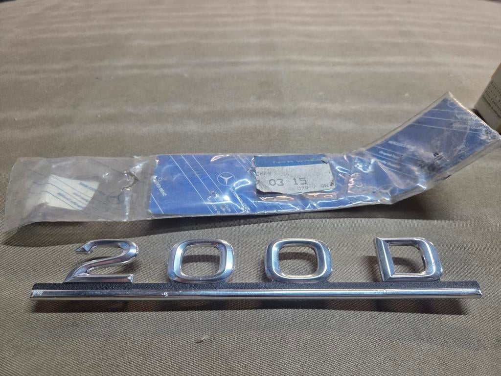 Mercedes-Benz W123 200D logo nieuw 1238170315, Ophalen of Verzenden, Nieuw, Mercedes-Benz, Bumper