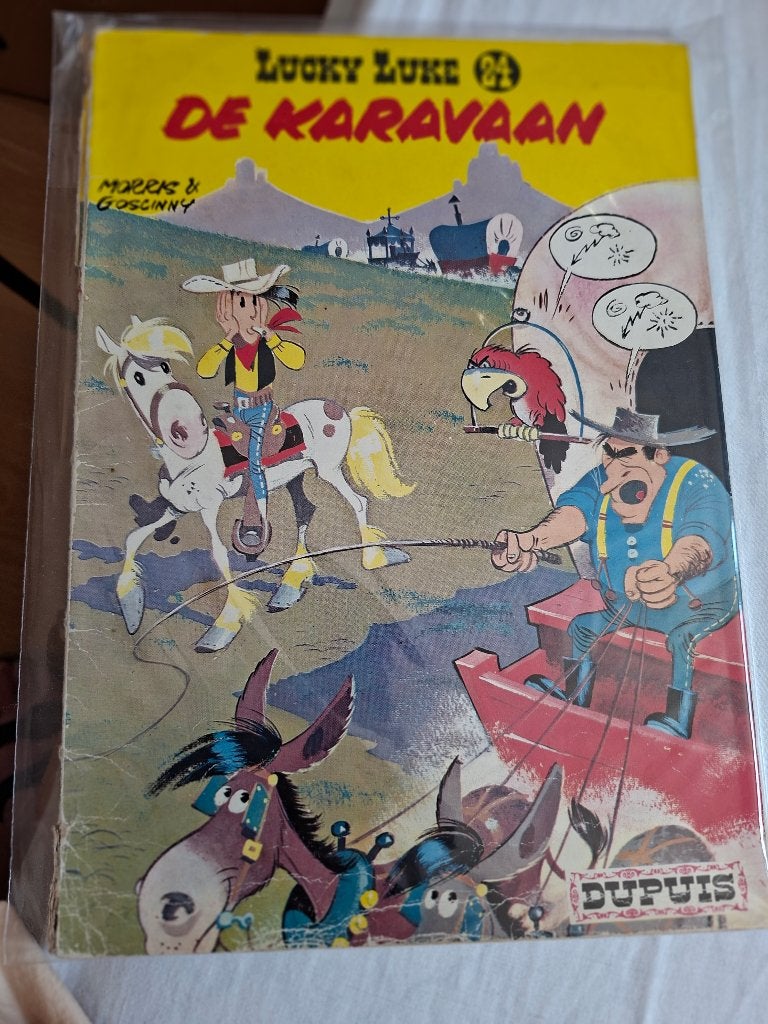 Lucky Luke 24, de karavaan, Eén stripboek, Ophalen of Verzenden, Gelezen