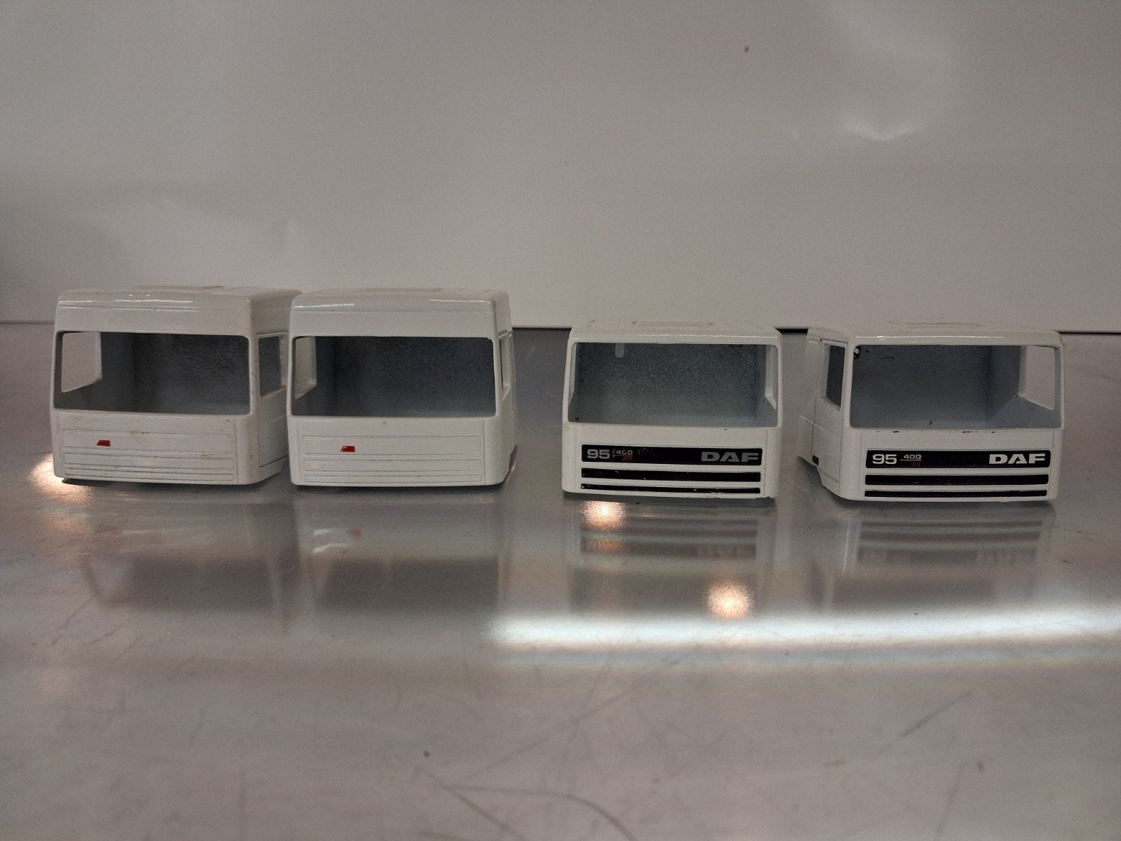 4 kale Lion Toys DAF 95 cabines, Ophalen of Verzenden, Zo goed als nieuw, Bus of Vrachtwagen, Lion Toys
