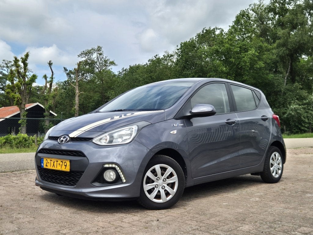 Hyundai i10 1.0i i-Motion Comf.+ (bj 2014), Auto's, Euro 5, Gebruikt, 31 €/maand, 4 stoelen