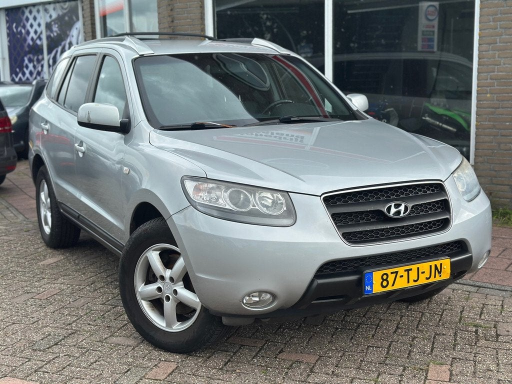 Hyundai Santa Fe 2.7i V6 Dynamic - Clima - Cruise - Trekhaak, Auto's, Hyundai, Voorwielaandrijving, Gebruikt, Zwart, 2000 kg