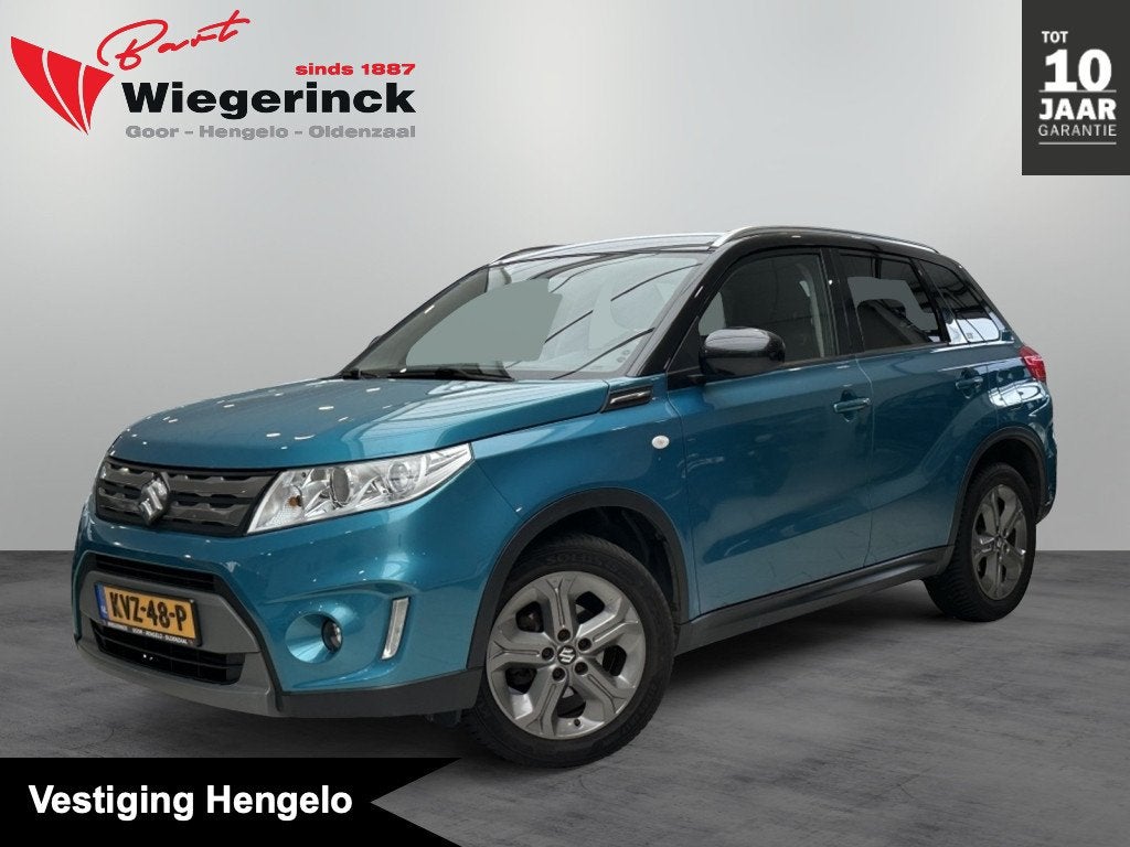 Suzuki Vitara 1.6 Exclusive [ TREKHAAK | ALL-SEASON | CAMERA, Auto's, 12 maanden, Stof, Gebruikt, 4 cilinders