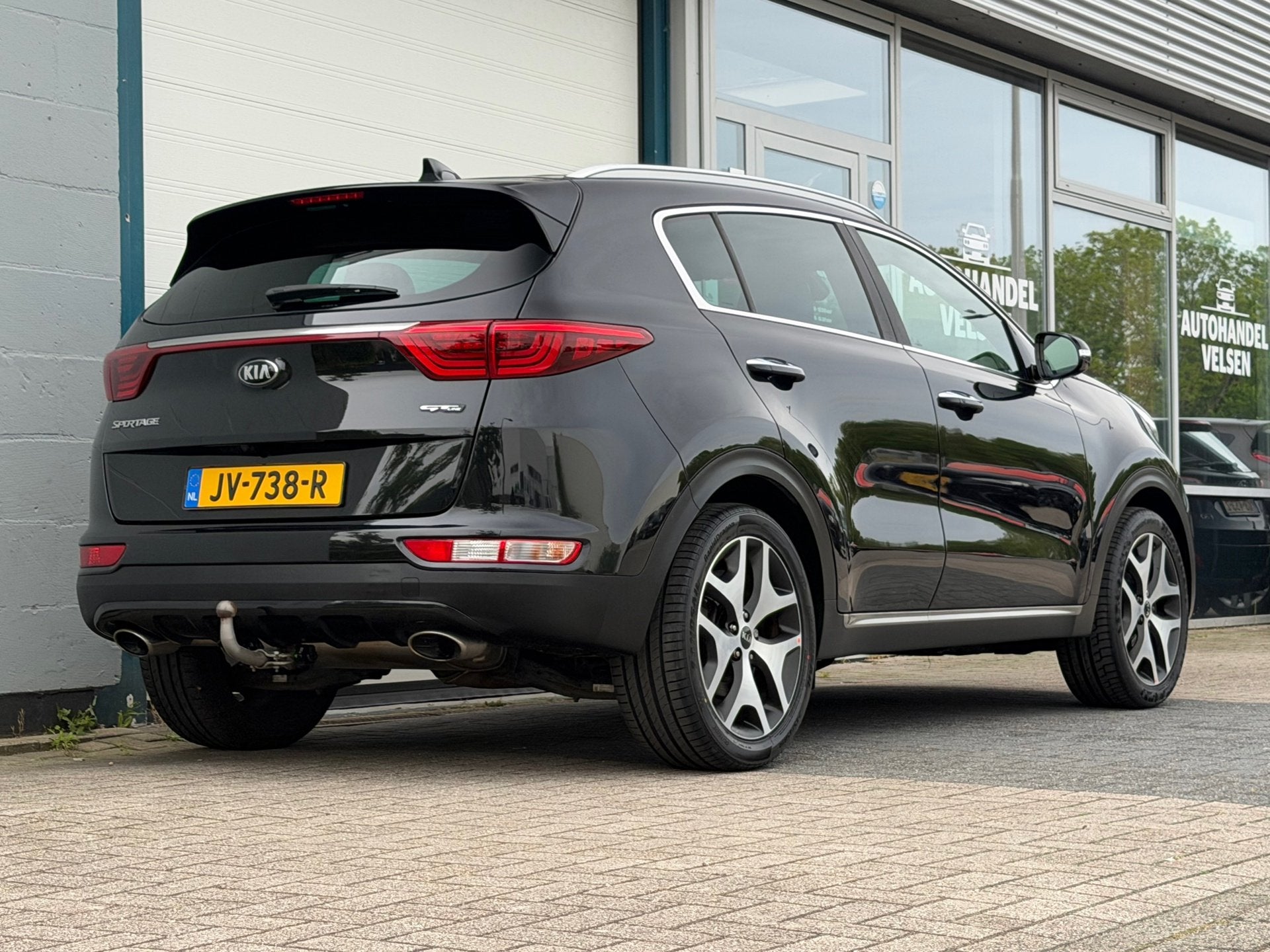 Kia Sportage 1.6 T-GDI 4WD GT-Line First Edition Automaat, Auto's, Gebruikt, 4 cilinders, Zwart, Bedrijf