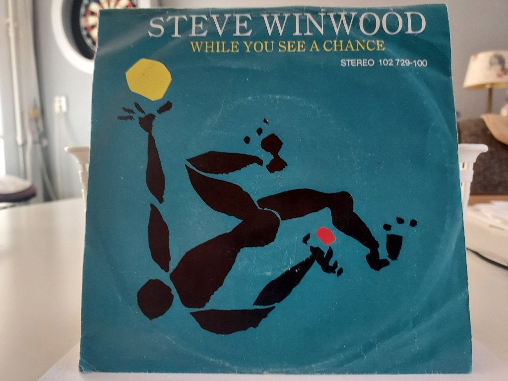 7" Single Steve Winwood - While You See A Chance / Vacant, Gebruikt, 7 inch, Ophalen of Verzenden, Pop