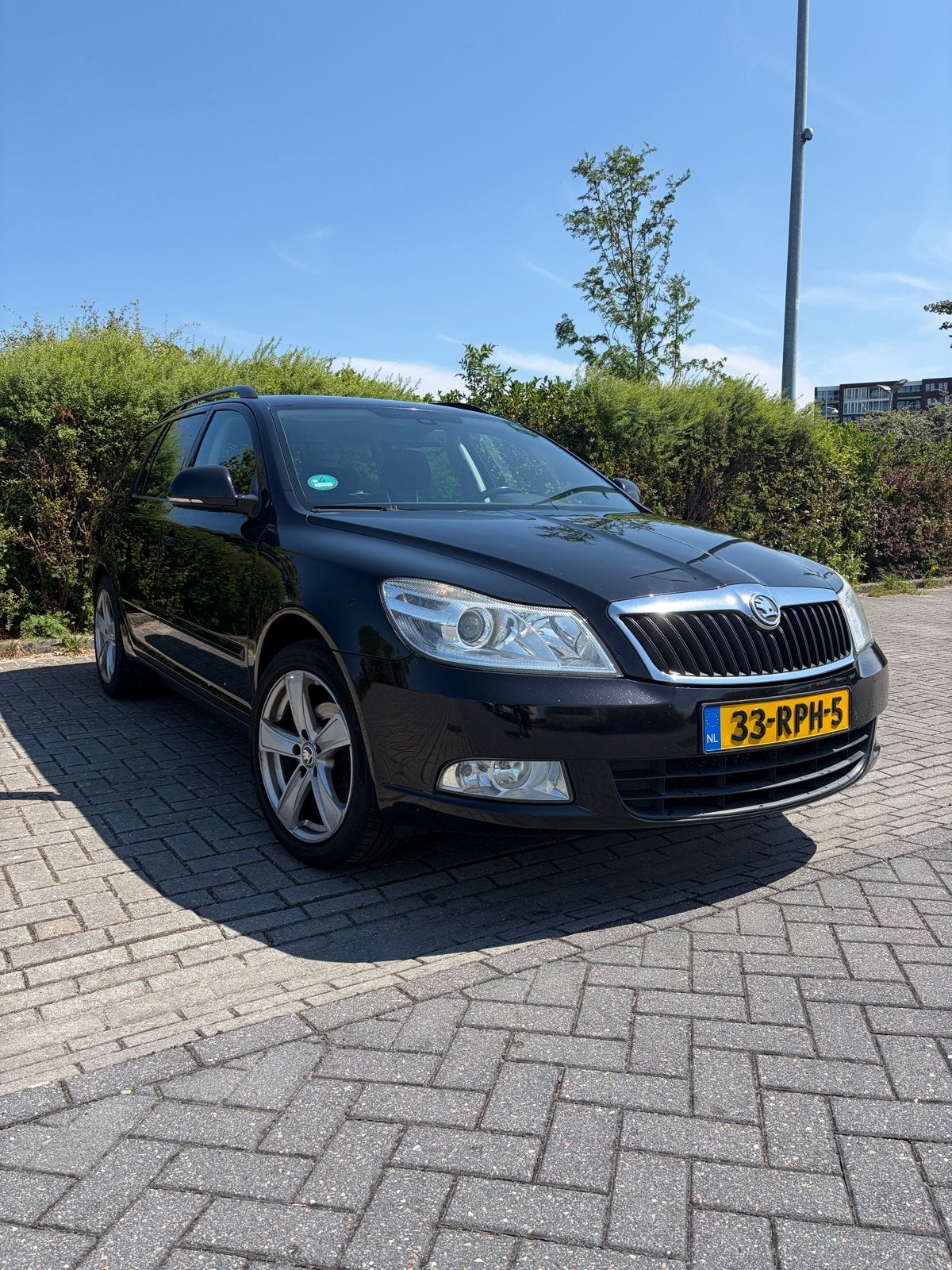 Skoda Octavia Combi Business 1.2 TSI | 2011, Auto's, Voorwielaandrijving, Dealer onderhouden, Zwart, 4 cilinders