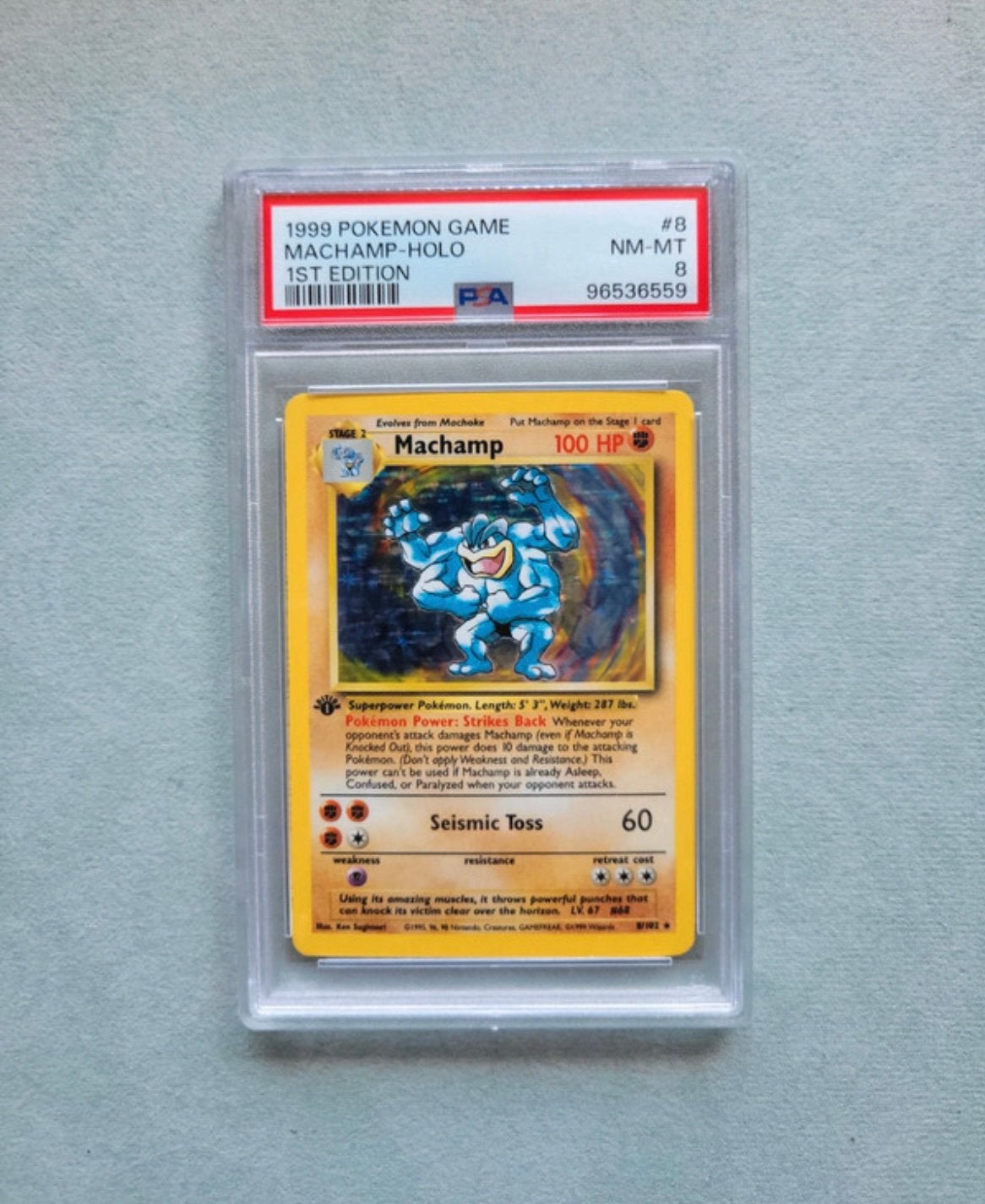 Machamp 1st edition holo PSA 8, Ophalen of Verzenden, Zo goed als nieuw