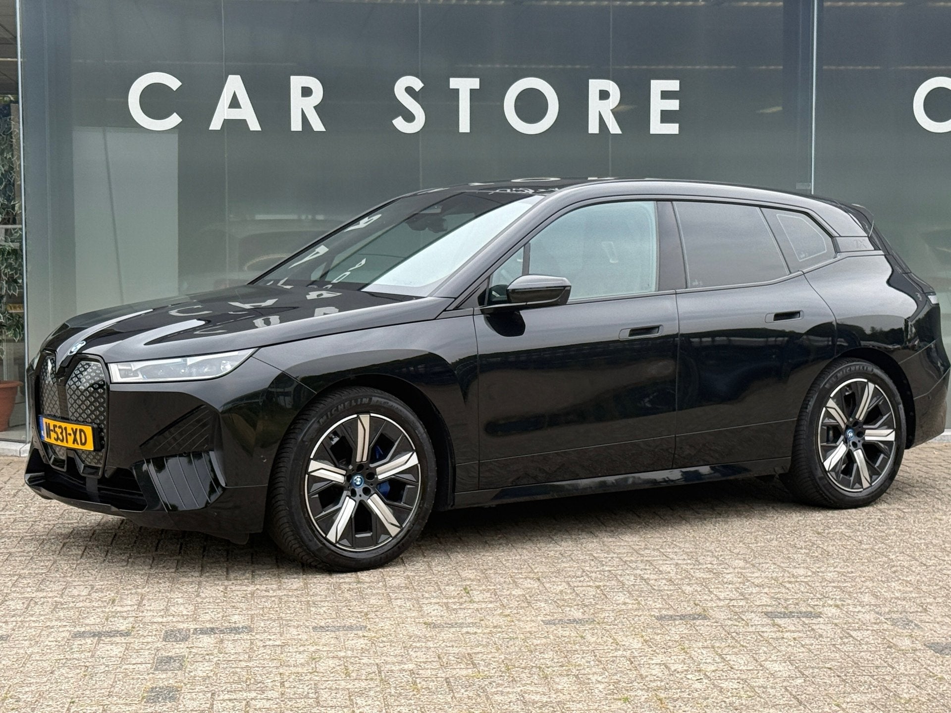 BMW IX XDrive40 High Executive 77 kWh 96% soh PANO|B&W|Trekh, Auto's, BMW, Automaat, Gebruikt, Zwart, Zwart