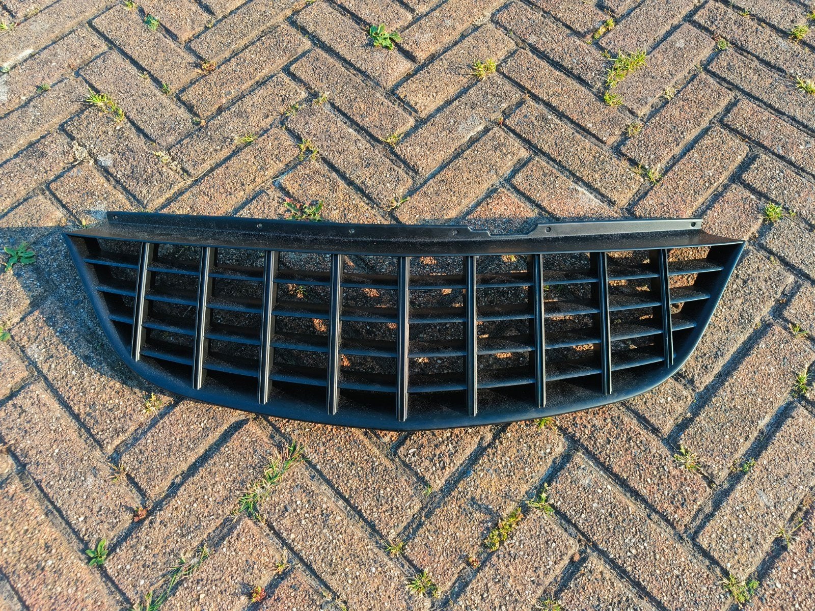 Opel Corsa D embleem loze grill, Voor, Opel, Nieuw, Ophalen of Verzenden