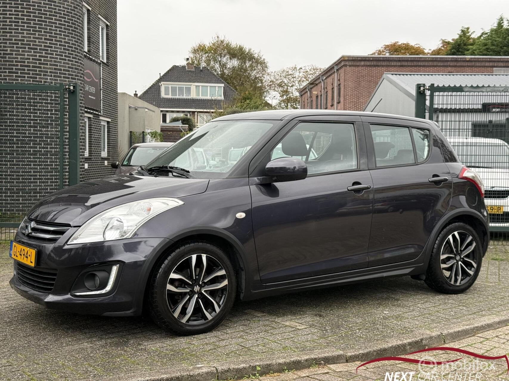 Suzuki Swift 1.2 Exclusive EASSS DEALER onderhouden, Gebruikt, 4 cilinders, 400 kg, Origineel Nederlands