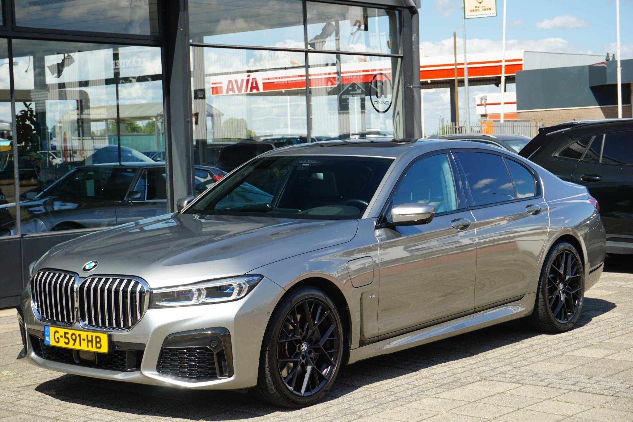 BMW 7-serie 745e High Executive | B&W | massage | tv | 4WS |, Auto's, BMW, Achterwielaandrijving, Gebruikt, 394 pk, Met garantie (alle)