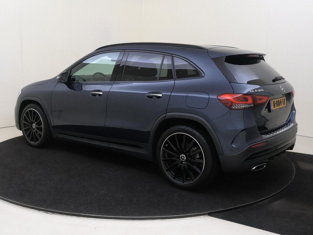Mercedes-Benz GLA-klasse 180 AMG Line, Auto's, Gebruikt, 4 cilinders, Blauw, Leder en Stof