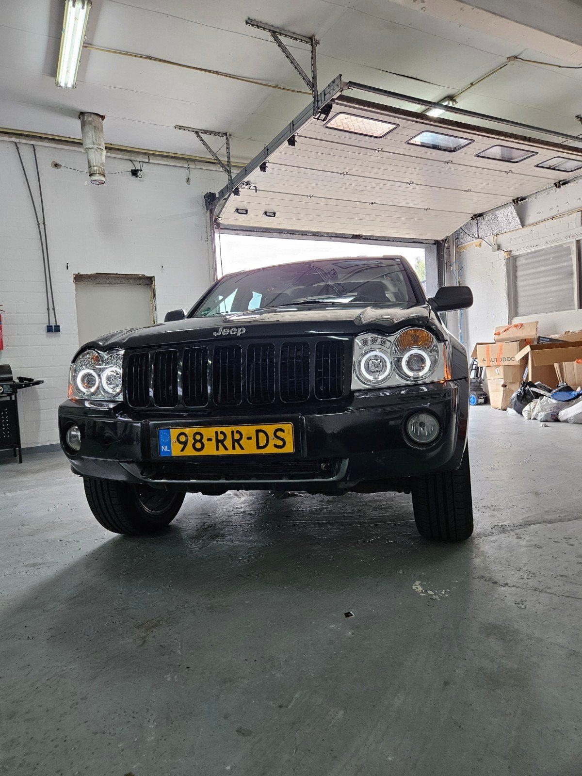 Jeep Grand Cherokee 5.7 I V8 Hemi AUT 2005 Zwart, Auto's, Automaat, Automatische klimaatregeling, 8 cilinders, 5654 cc
