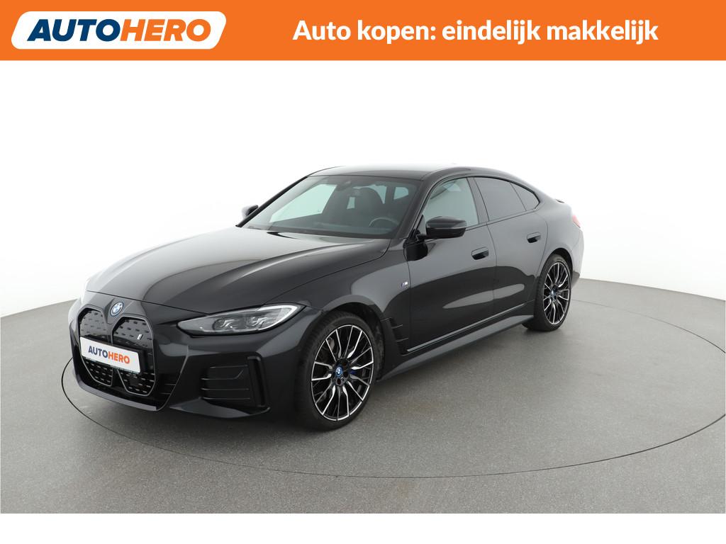 BMW i4 eDrive40 84 kWh | TA13501 | (bj 2023, automaat), Achterwielaandrijving, Gebruikt, Met garantie (alle), Leder en Stof