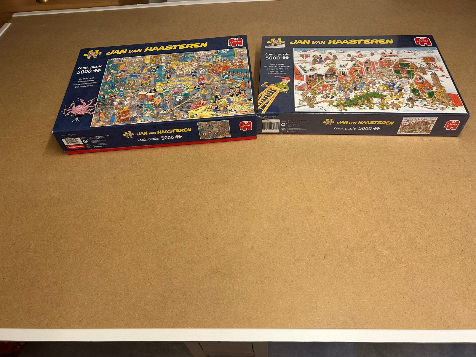 2 Puzzels Jan van Haasteren 5000 stukjes + puzzel plaat., Hobby en Vrije tijd, Denksport en Puzzels, Ophalen, 500 t/m 1500 stukjes