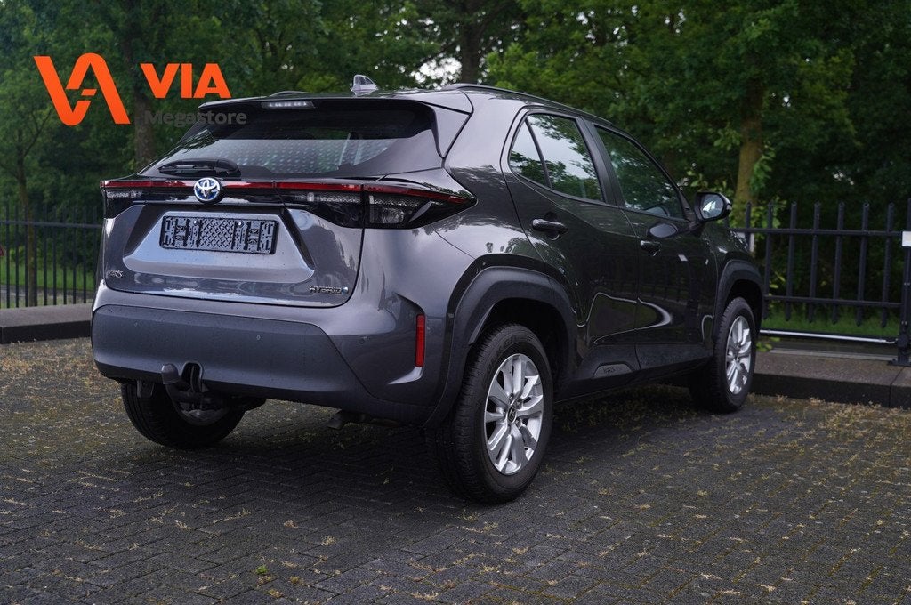 Toyota Yaris Cross 1.5 Hybrid 115PK | Trekhaak | Camera | Na, Auto's, Toyota, Automaat, Gebruikt, Met garantie (alle), 116 pk