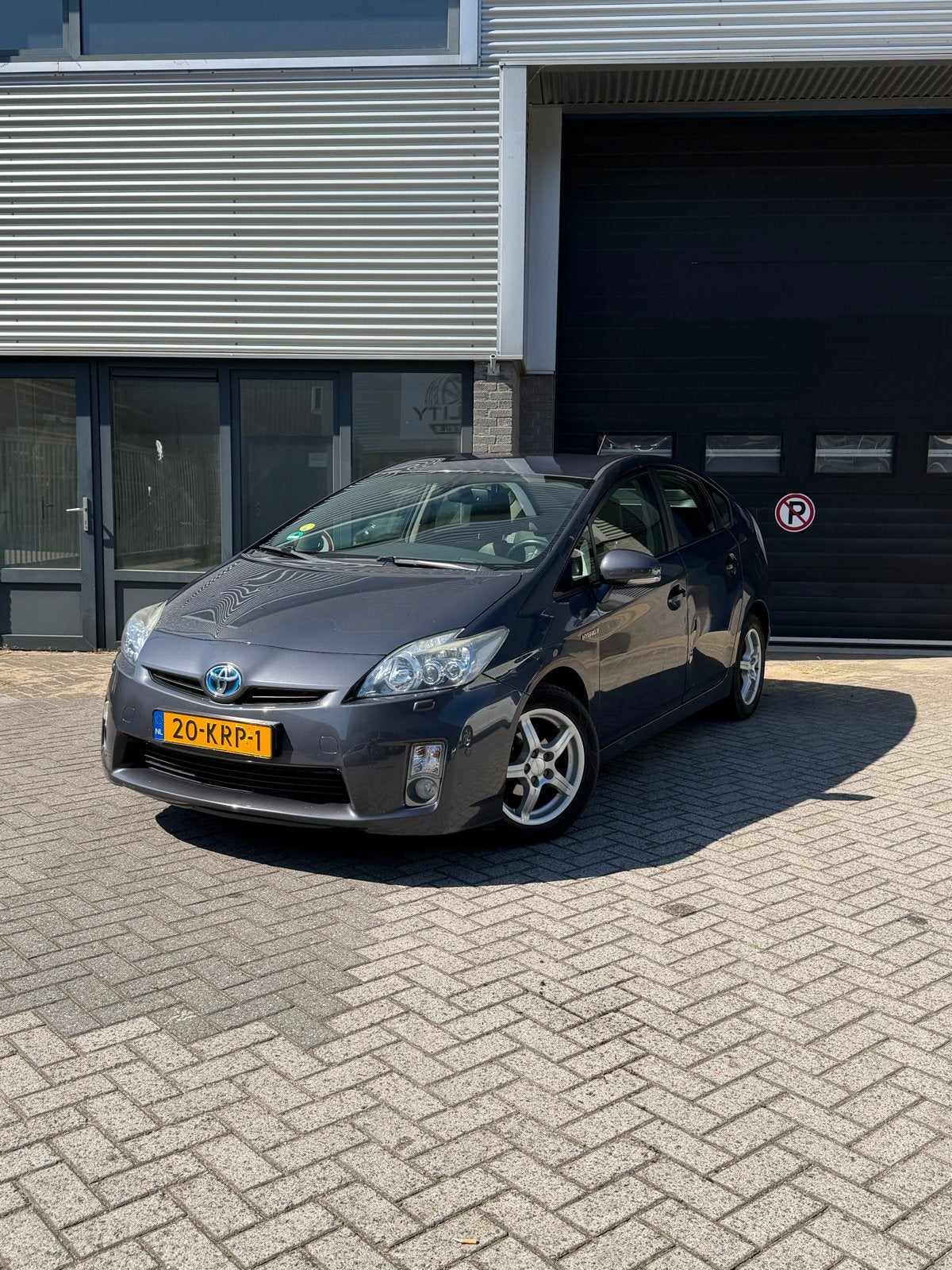 Toyota Prius 1.8 Full Hybrid 136PK Aut 2010 Grijs, Auto's, 1345 kg, Stof, Zwart, 4 cilinders