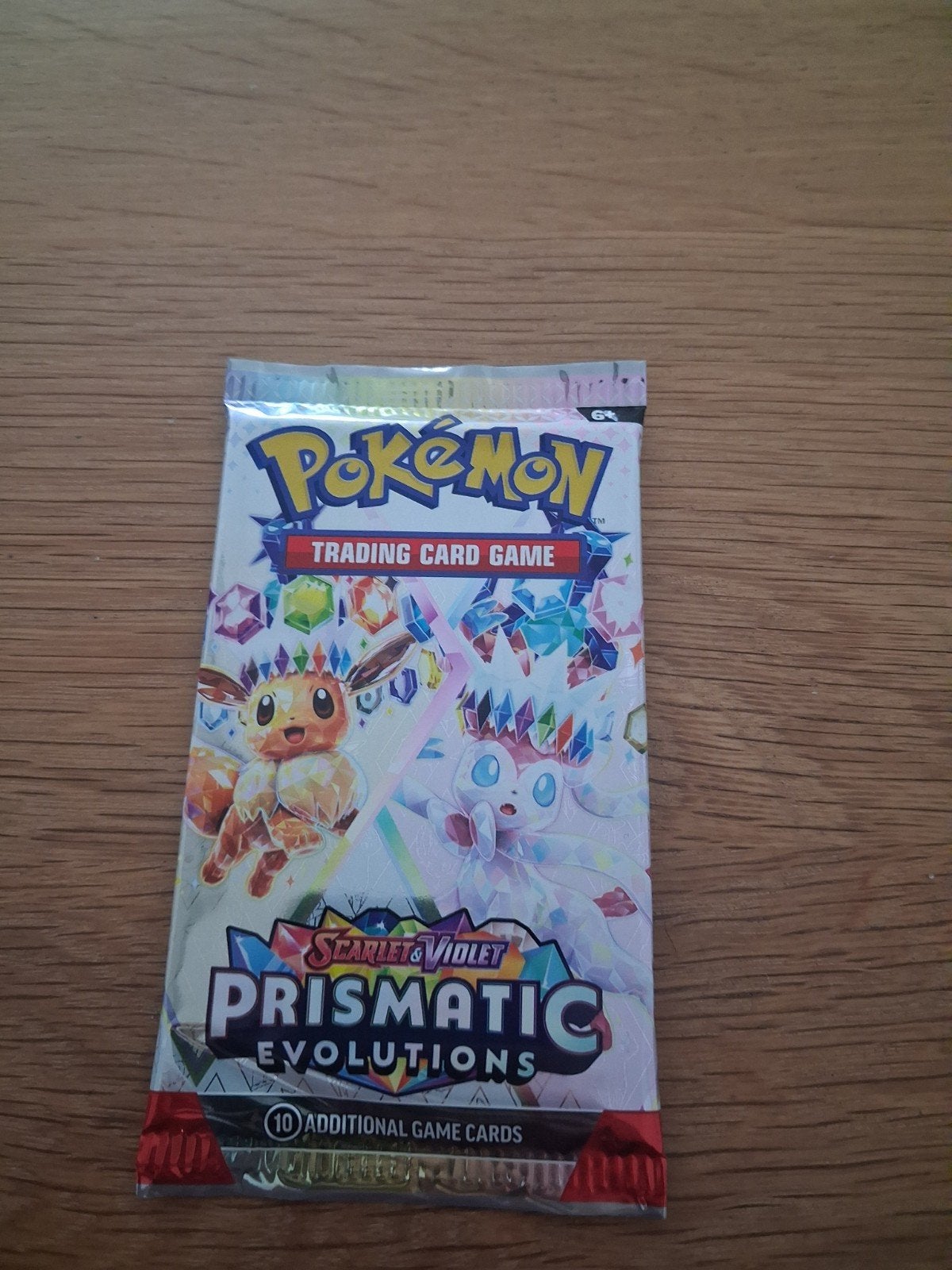 Pokémon Prismatic Evolutions Booster meerdere beschikbaar, Hobby en Vrije tijd, Ophalen of Verzenden, Nieuw, Booster, Foil