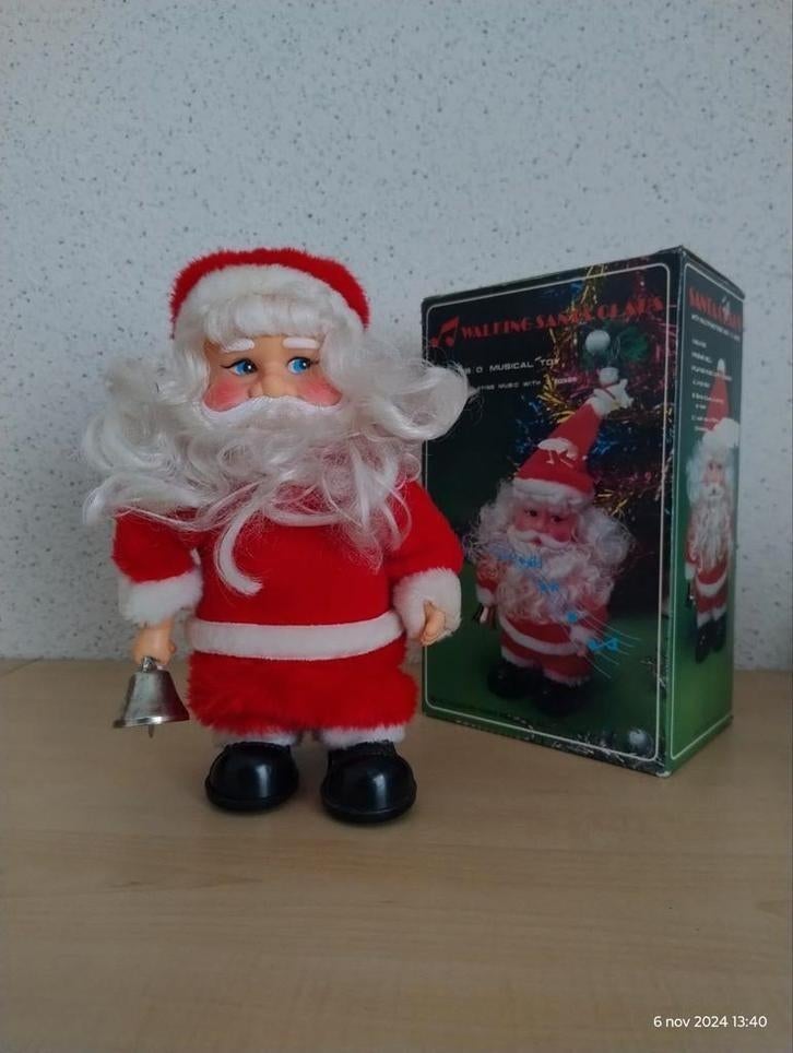 Muziekmakende kerstman.  25 cm., Ophalen of Verzenden, Zo goed als nieuw