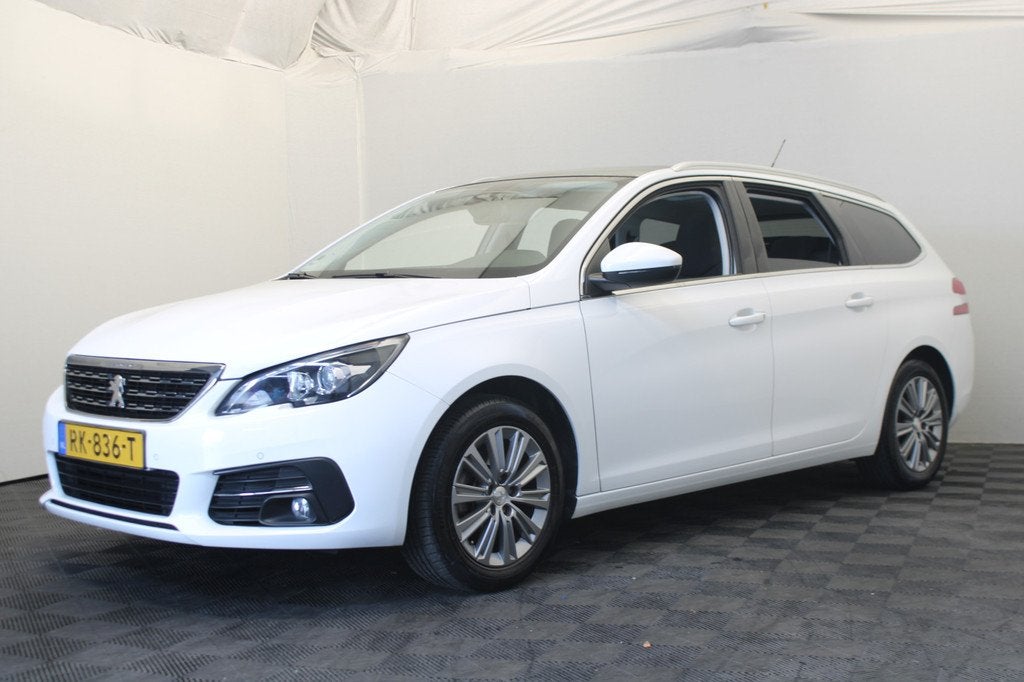 Peugeot 308 SW 1.2 PureTech Blue Lease Premium |Pano|Navi|Ca, Auto's, Gebruikt, 1199 cc, 635 kg, Leder en Stof