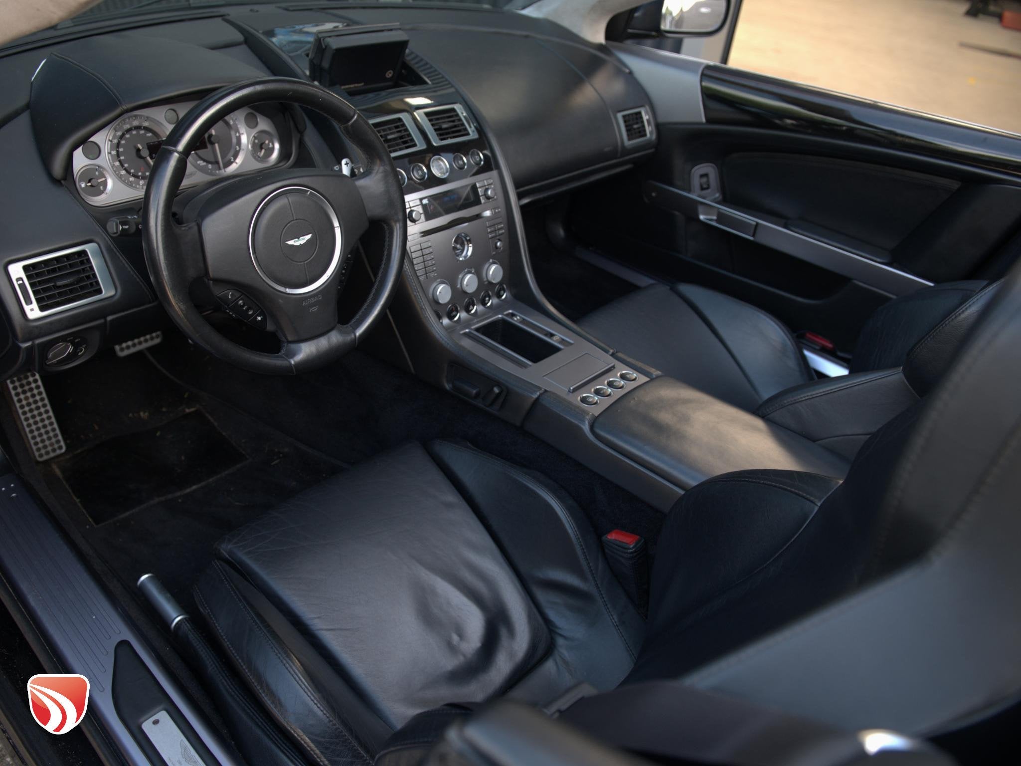Aston Martin DB9 Volante 5.9 V12 Touchtronic 457pk | Dealero, Auto's, Automaat, 5935 cc, Zwart, Leder