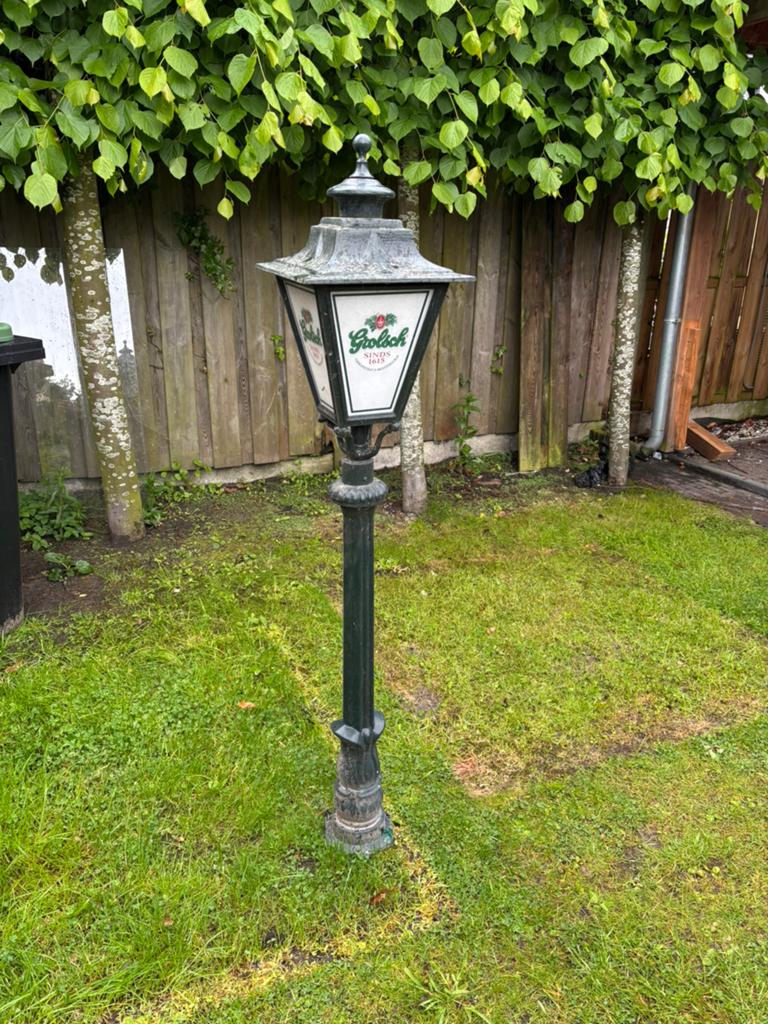 Grolsch buitenlamp, Ophalen