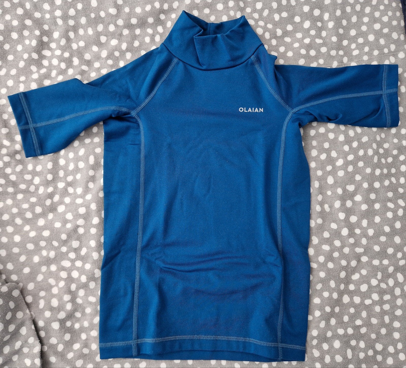 Blauw UV-zwemshirt OLAIAN leeftijd 6jr, Overige maten, Ophalen of Verzenden, Zo goed als nieuw, Overig