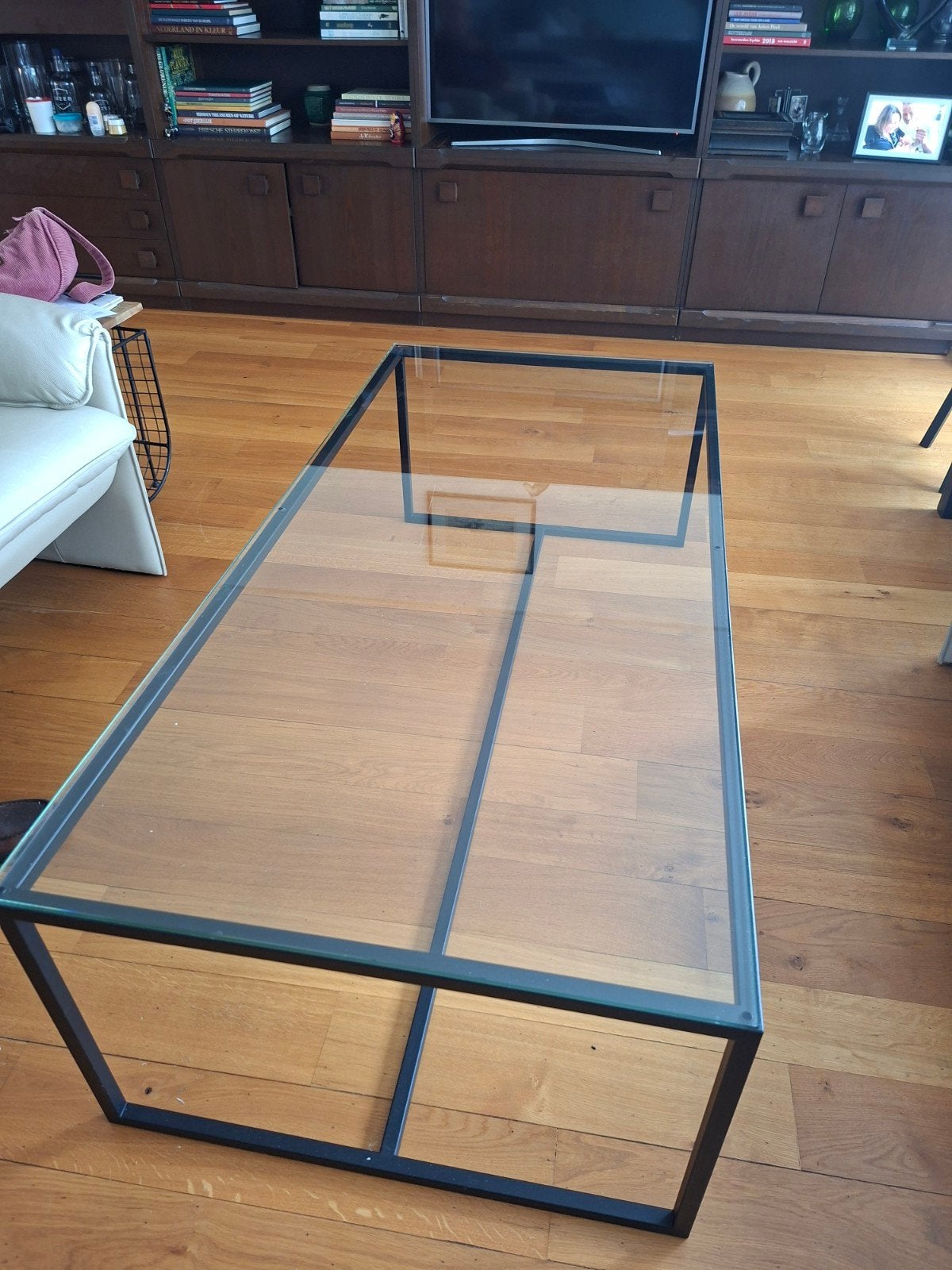 Glazen salontafel met zwart metalen frame, Ophalen, Gebruikt, 100 tot 150 cm, 50 tot 100 cm