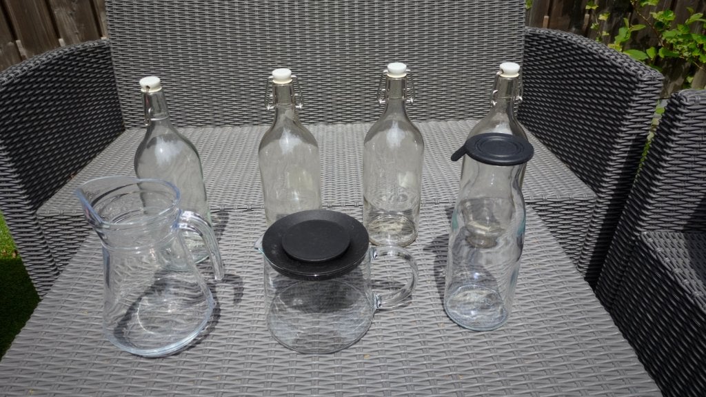 diverse glazen flessen, Ophalen