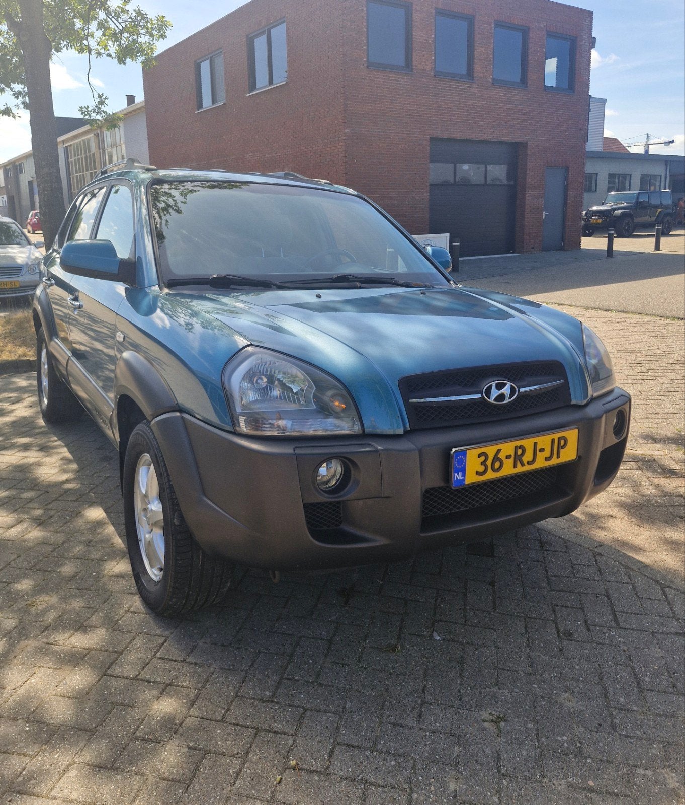 Hyundai Tucson 2.0 I 2WD 2005 Blauw (nieuwe APK), Auto's, Stof, 4 cilinders, Blauw, Multifunctioneel stuurwiel