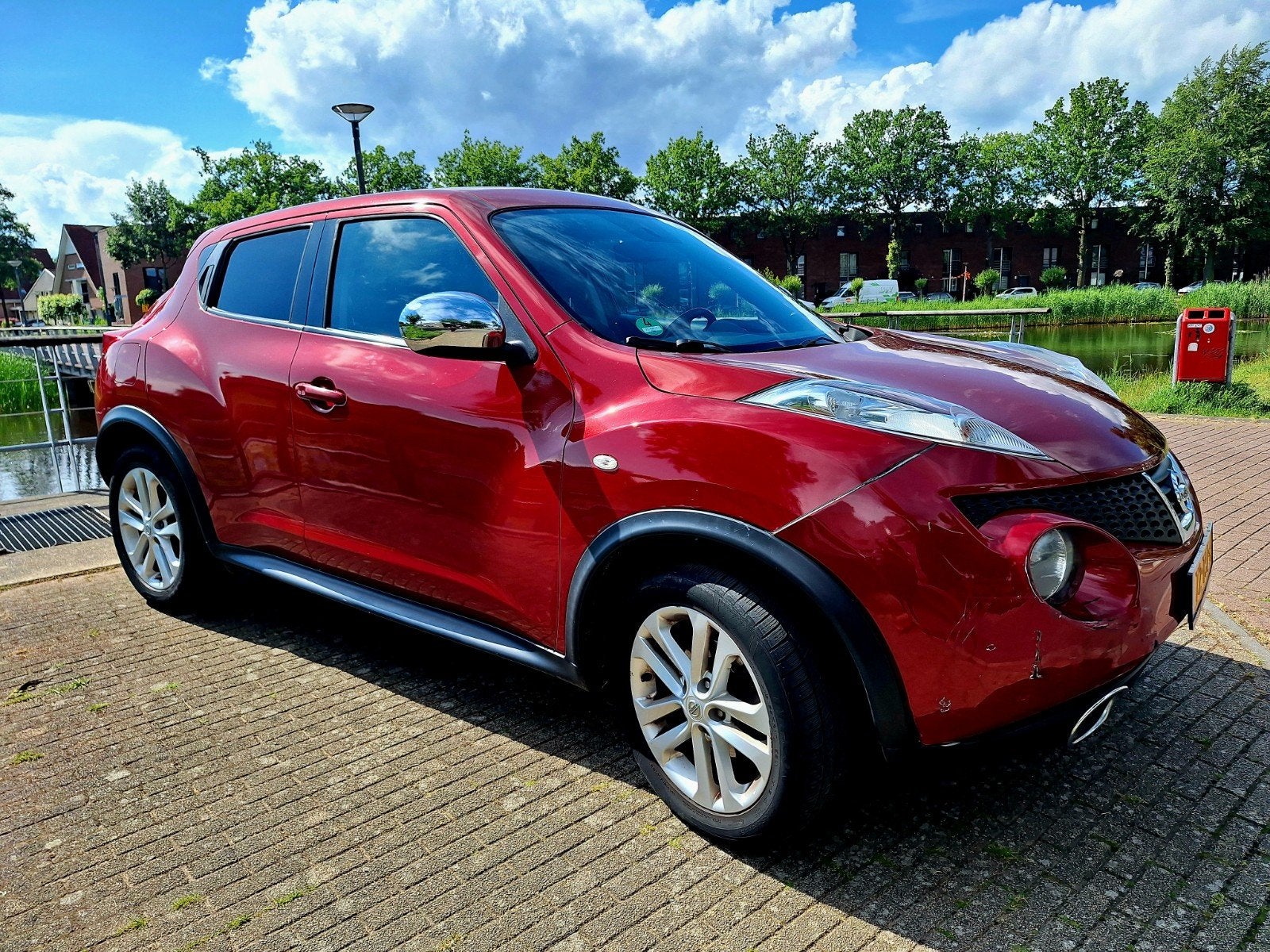 Nissan Juke 1.6 Eco 117pk 2012 Rood, Auto's, Stof, 1250 kg, Zwart, 4 cilinders